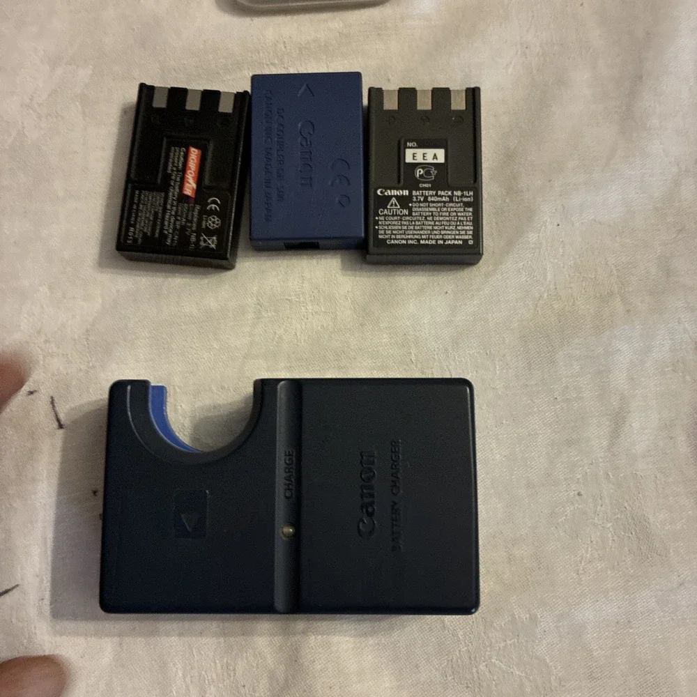 canon battery charger CB-2LS, 3 batteries, And One Sim Card Working